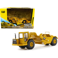 Diecast Masters 85695 CAT Wheel Tractor 611 Scraper   1/64